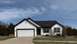 283 Sonnet Cir, Wentzville, MO 63385 - ranch-style house with a garage and driveway