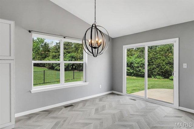 283 Sonnet Cir, Wentzville, MO 63385 - unfurnished dining area featuring a chandelier, baseboards, and vaulted ceiling