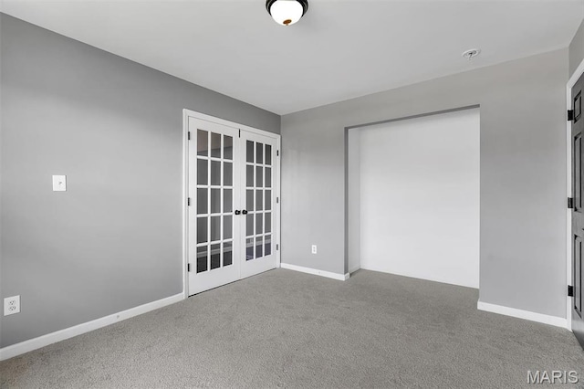 283 Sonnet Cir, Wentzville, MO 63385 - carpeted empty room featuring french doors and baseboards