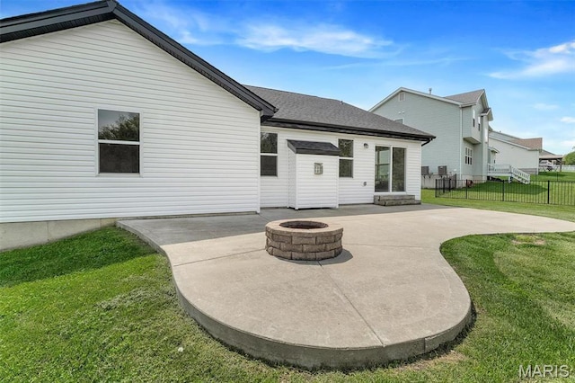 283 Sonnet Cir, Wentzville, MO 63385 - rear view of house with a patio and a fire pit