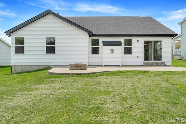 283 Sonnet Cir, Wentzville, MO 63385 - rear view of house featuring a patio area, a lawn, and roof with shingles