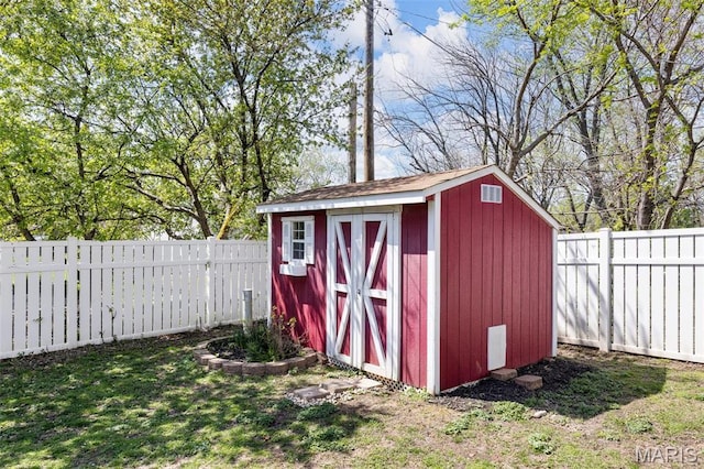 view of shed featuring a fenced backyard
