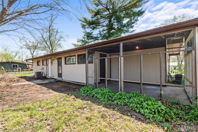 1500 Ridgewood Dr, Saint Louis, MO 63126 - back of property with central air condition unit and a sunroom