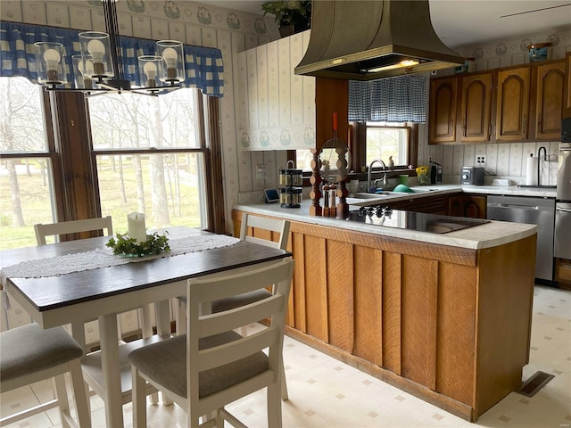 676 Frontier Ln, Bourbon, MO 65441 - kitchen with custom range hood, wallpapered walls, black electric stovetop, dishwasher, and a chandelier