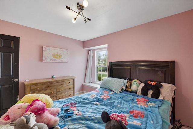 bedroom featuring baseboards