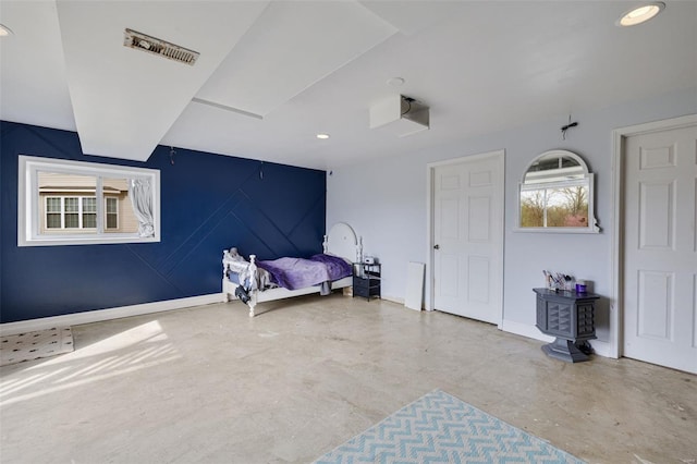 bedroom with concrete floors, recessed lighting, and baseboards