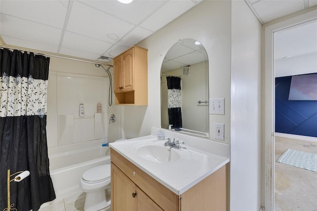 bathroom featuring a paneled ceiling, vanity, shower / bath combination with curtain, and toilet