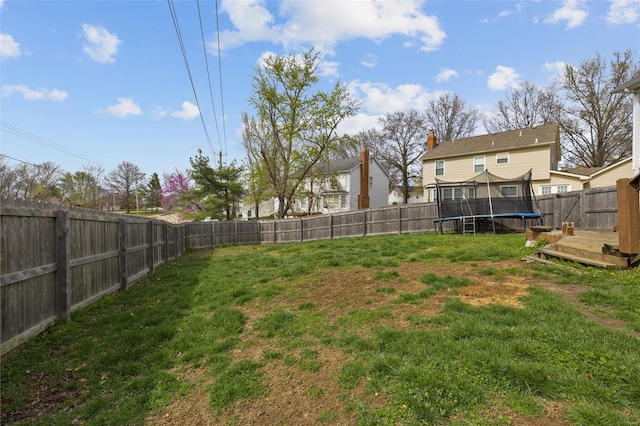 view of yard with a trampoline