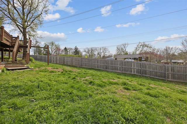 view of yard with stairway and a wooden deck