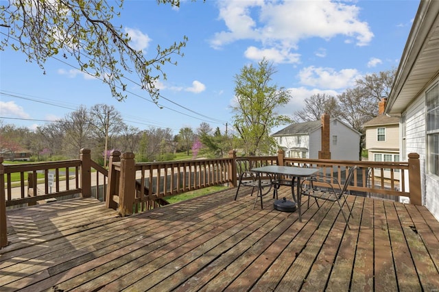 wooden terrace with outdoor dining area