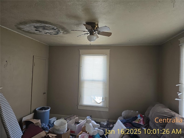 215 W 17th St, Centralia, IL 62801 - unfurnished bedroom with a textured ceiling and ceiling fan