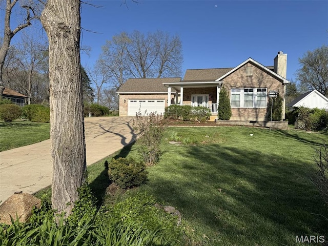 602 S Ballas Rd, Saint Louis, MO 63122 - view of front of property featuring concrete driveway, brick siding, a garage, and a front yard