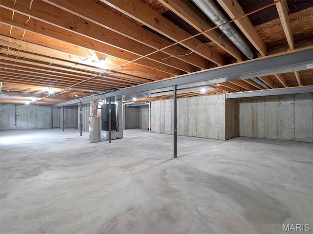 602 S Ballas Rd, Saint Louis, MO 63122 - unfinished basement featuring heating unit and electric water heater
