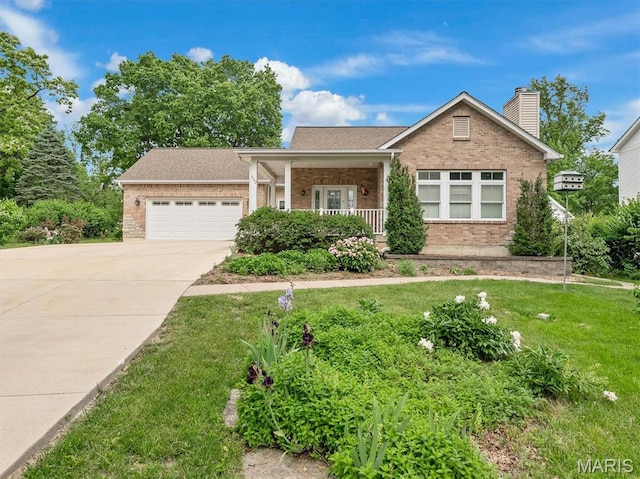 602 S Ballas Rd, Saint Louis, MO 63122 - view of front of home featuring brick siding, an attached garage, a front yard, and driveway