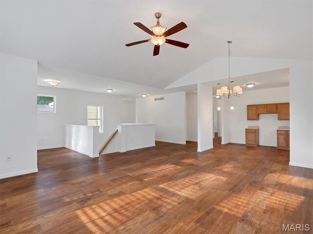 602 S Ballas Rd, Saint Louis, MO 63122 - unfurnished living room with a chandelier, ceiling fan, dark wood-style flooring, and lofted ceiling