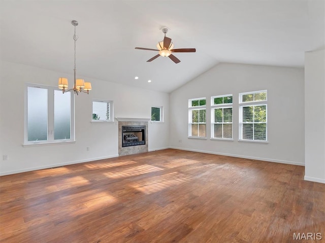 602 S Ballas Rd, Saint Louis, MO 63122 - unfurnished living room with a ceiling fan, a chandelier, vaulted ceiling, wood finished floors, and a fireplace