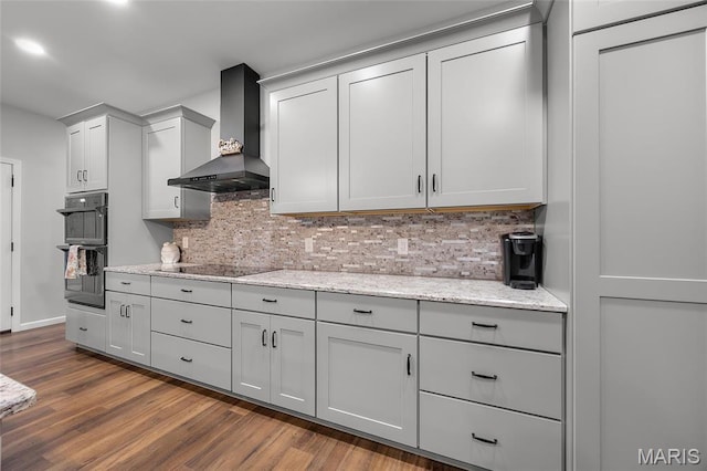 13160 Mammoth Rd, De Soto, MO 63020 - kitchen with wall chimney range hood, black appliances, dark wood-type flooring, and decorative backsplash