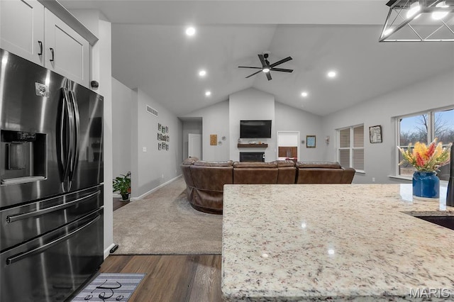 13160 Mammoth Rd, De Soto, MO 63020 - kitchen with stainless steel fridge, a ceiling fan, dark wood finished floors, lofted ceiling, and white cabinets