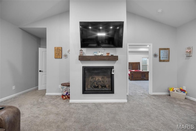 13160 Mammoth Rd, De Soto, MO 63020 - carpeted living room featuring lofted ceiling and a glass covered fireplace