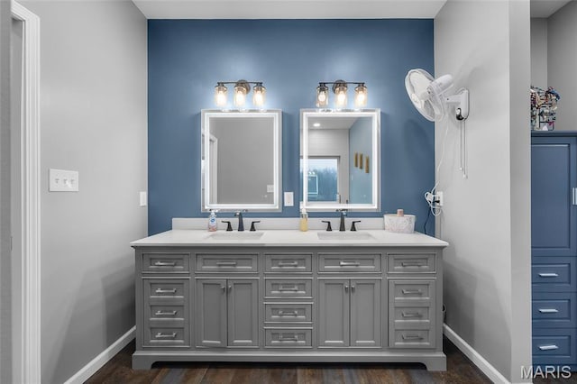 13160 Mammoth Rd, De Soto, MO 63020 - bathroom featuring double vanity and wood finished floors