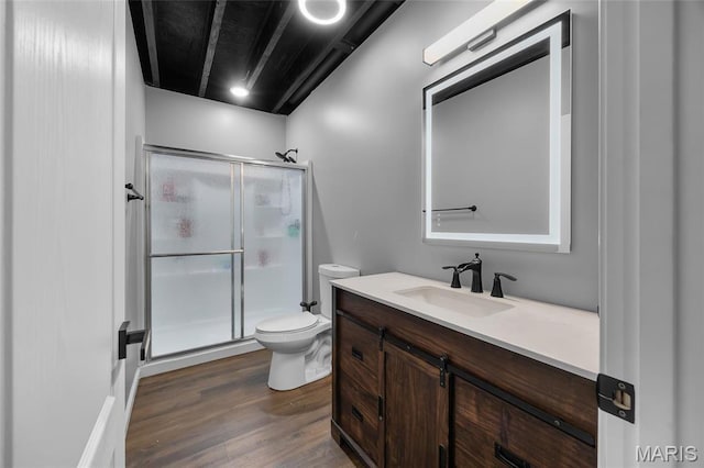 13160 Mammoth Rd, De Soto, MO 63020 - bathroom featuring a shower stall, vanity, and wood finished floors