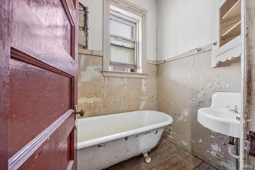 2926 Dodier, Saint Louis, MO 63107 - bathroom featuring a freestanding tub and wood finished floors