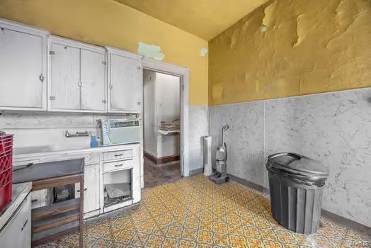 2926 Dodier, Saint Louis, MO 63107 - kitchen with white cabinets and light countertops