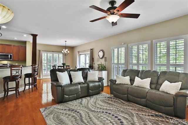1304 Forest Way, Wentzville, MO 63385 - living room with recessed lighting, a chandelier, ceiling fan, wood finished floors, and baseboards