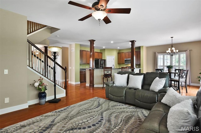 1304 Forest Way, Wentzville, MO 63385 - living area featuring ornate columns, a chandelier, a ceiling fan, wood finished floors, and recessed lighting