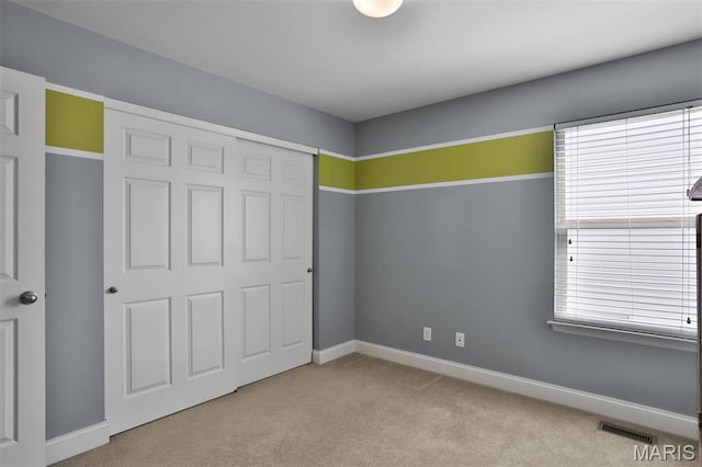 1304 Forest Way, Wentzville, MO 63385 - unfurnished bedroom featuring carpet, baseboards, and a closet