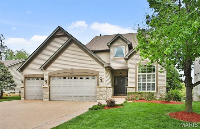 1304 Forest Way, Wentzville, MO 63385 - view of front of property with driveway, an attached garage, stone siding, and a front yard