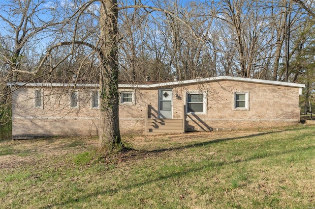343 Del Vista Dr, Villa Ridge, MO 63089 - view of front of house with brick siding, entry steps, and a front lawn