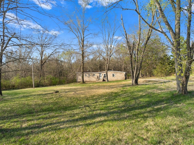343 Del Vista Dr, Villa Ridge, MO 63089 - view of green lawn with a wooded view