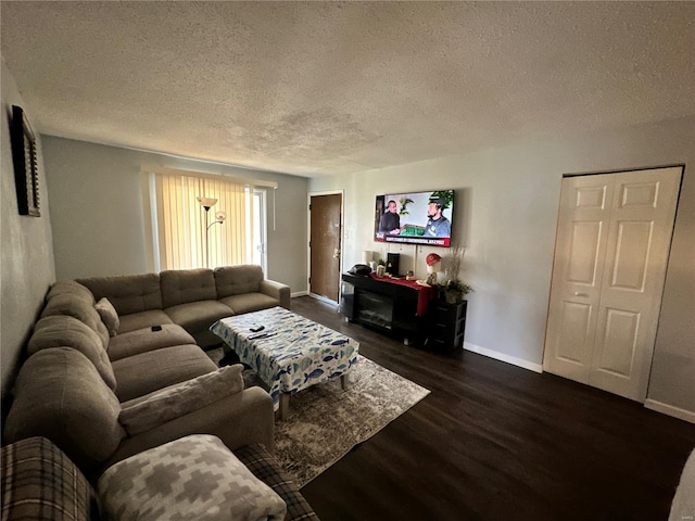 2804 Blackforest Dr Unit A, Saint Louis, MO 63129 - living area featuring a textured ceiling, dark wood-type flooring, and baseboards