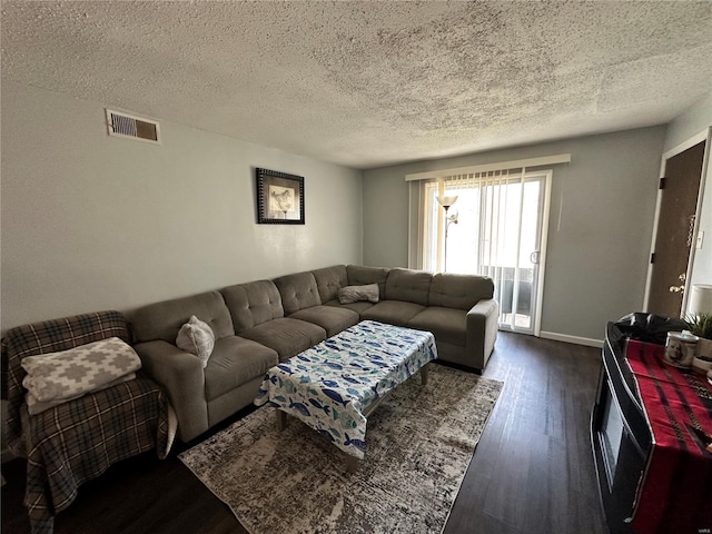 2804 Blackforest Dr Unit A, Saint Louis, MO 63129 - living area featuring dark wood-type flooring, a textured ceiling, and baseboards