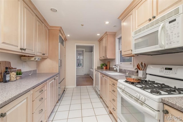 44 Kingsbury Pl, Saint Louis, MO 63112 - kitchen featuring white appliances, light brown cabinetry, light tile patterned floors, recessed lighting, and light countertops