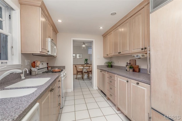 44 Kingsbury Pl, Saint Louis, MO 63112 - kitchen featuring white appliances, light brown cabinets, light tile patterned floors, a sink, and ceiling fan
