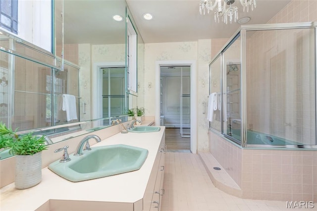 44 Kingsbury Pl, Saint Louis, MO 63112 - bathroom featuring a tile shower, a chandelier, recessed lighting, and double vanity