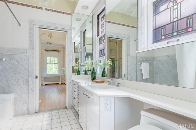 44 Kingsbury Pl, Saint Louis, MO 63112 - bathroom featuring vanity, tile walls, toilet, and tile patterned floors