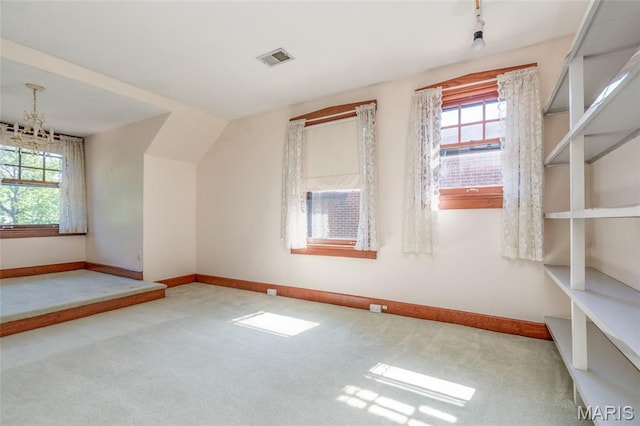 44 Kingsbury Pl, Saint Louis, MO 63112 - bonus room featuring carpet floors, a chandelier, and baseboards