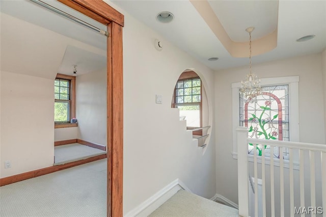 44 Kingsbury Pl, Saint Louis, MO 63112 - hall with a chandelier, baseboards, and carpet flooring