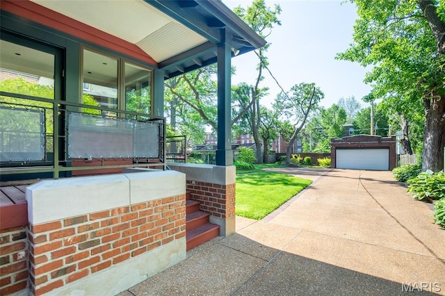 44 Kingsbury Pl, Saint Louis, MO 63112 - view of patio / terrace with driveway, a garage, and covered porch