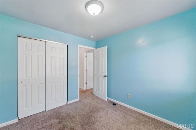 10660 Carroll Wood Way, Saint Louis, MO 63128 - unfurnished bedroom with carpet floors, baseboards, and a closet