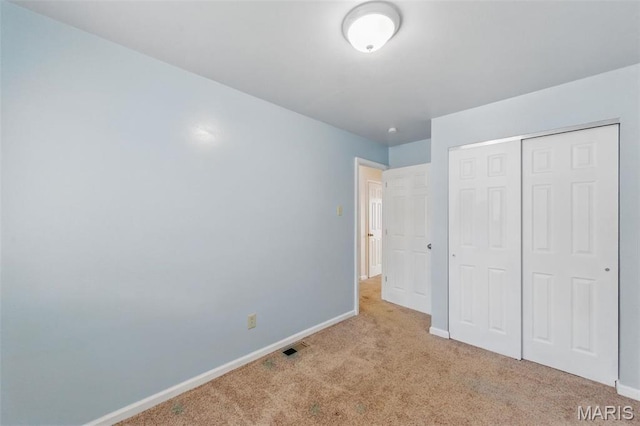 10660 Carroll Wood Way, Saint Louis, MO 63128 - unfurnished bedroom with carpet floors, baseboards, and a closet