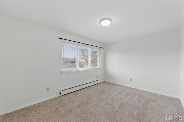 10660 Carroll Wood Way, Saint Louis, MO 63128 - carpeted empty room with a baseboard heating unit and baseboards