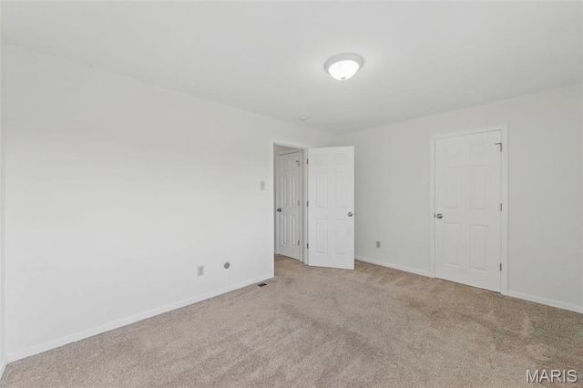 10660 Carroll Wood Way, Saint Louis, MO 63128 - spare room featuring light colored carpet and baseboards