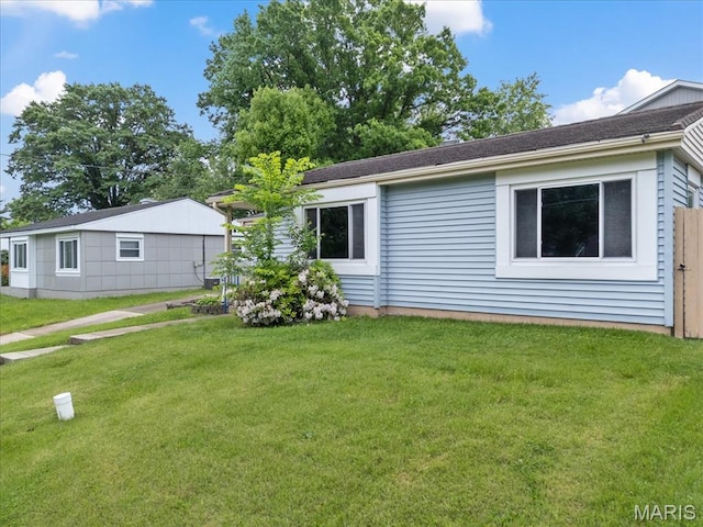 8934 Litzsinger Rd, Saint Louis, MO 63144 - view of side of home with a lawn