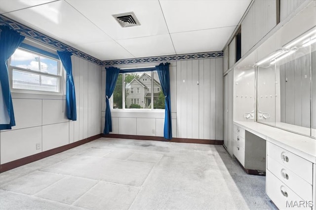 8934 Litzsinger Rd, Saint Louis, MO 63144 - unfurnished room with baseboards and wood walls