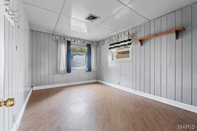 8934 Litzsinger Rd, Saint Louis, MO 63144 - unfurnished room featuring baseboards and wood walls