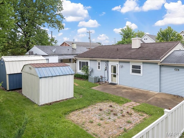 8934 Litzsinger Rd, Saint Louis, MO 63144 - rear view of property featuring a storage shed, an outdoor structure, a patio area, and cooling unit